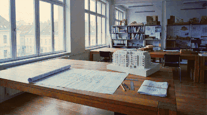 Planungsunterlagen und Architekturmodell in einem Planungsbüro